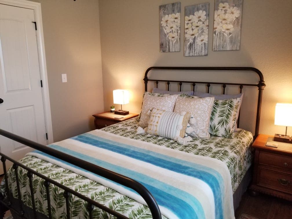 Third bedroom with double bed and striped bedding