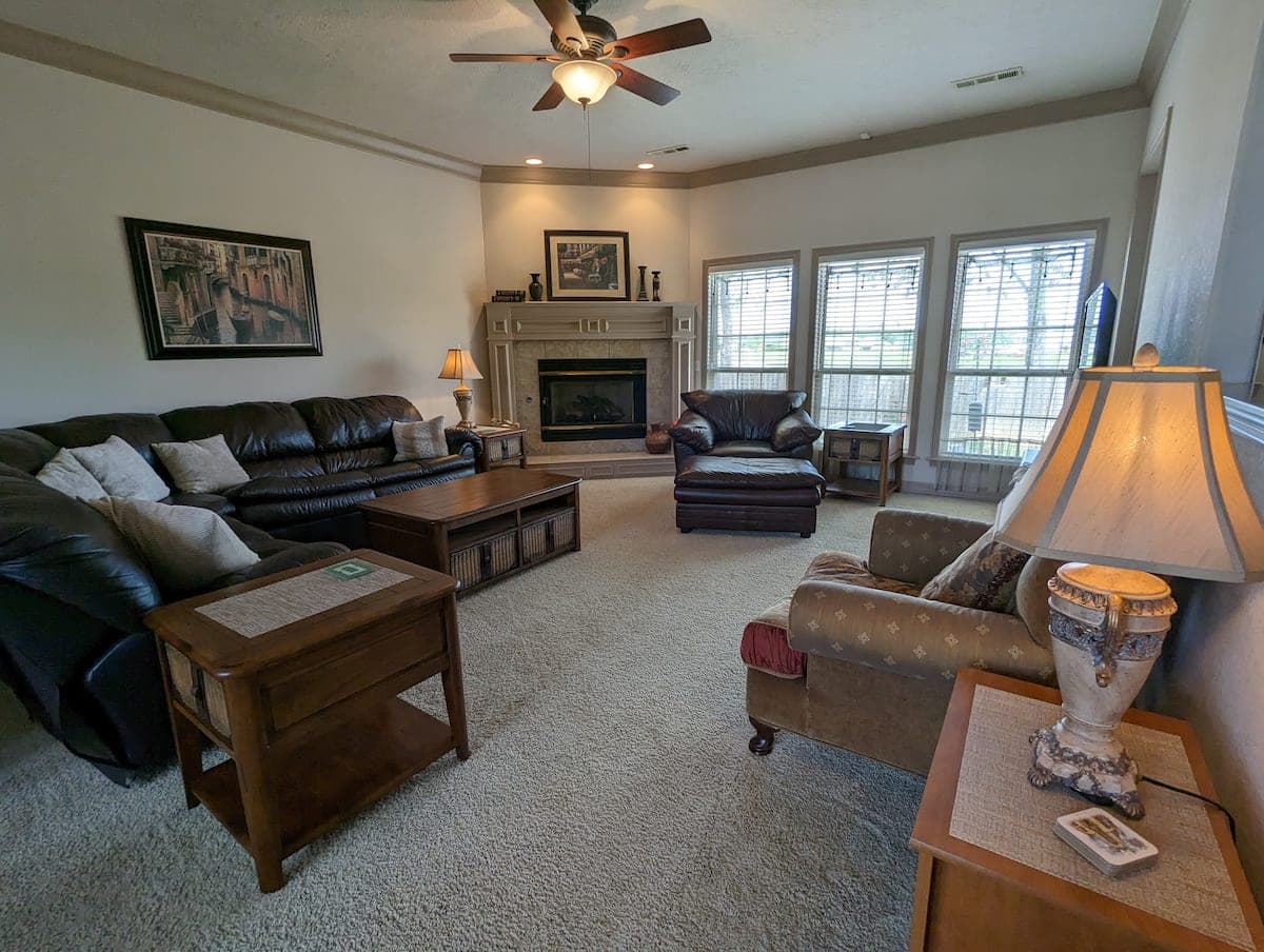Living room seating area with fireplace and lamp